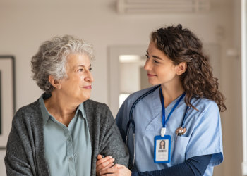 nurse comforting elderly