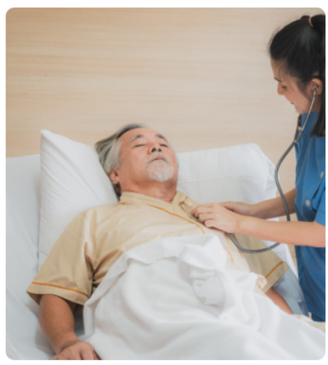 A nurse is checking the heartbeat of an older man.