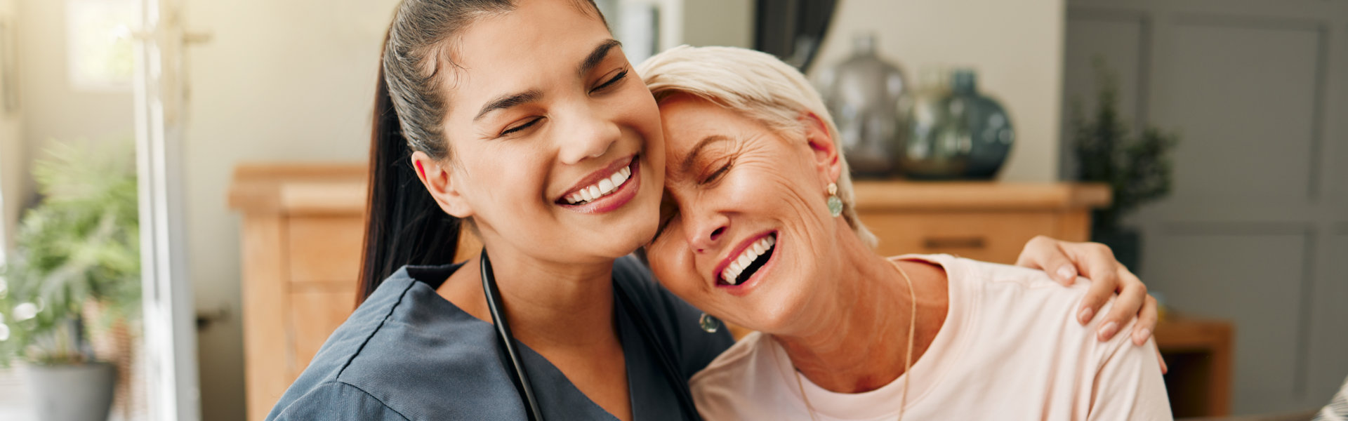 nurse comforting elderly woman